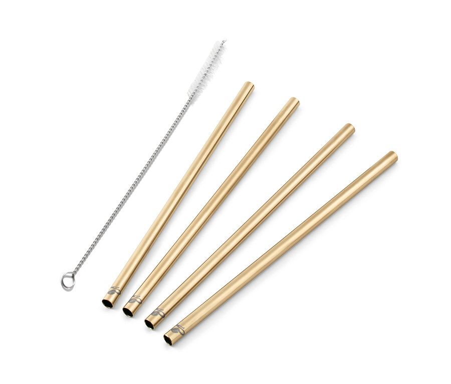 Quatre pailles en métal doré et une brosse de nettoyage.