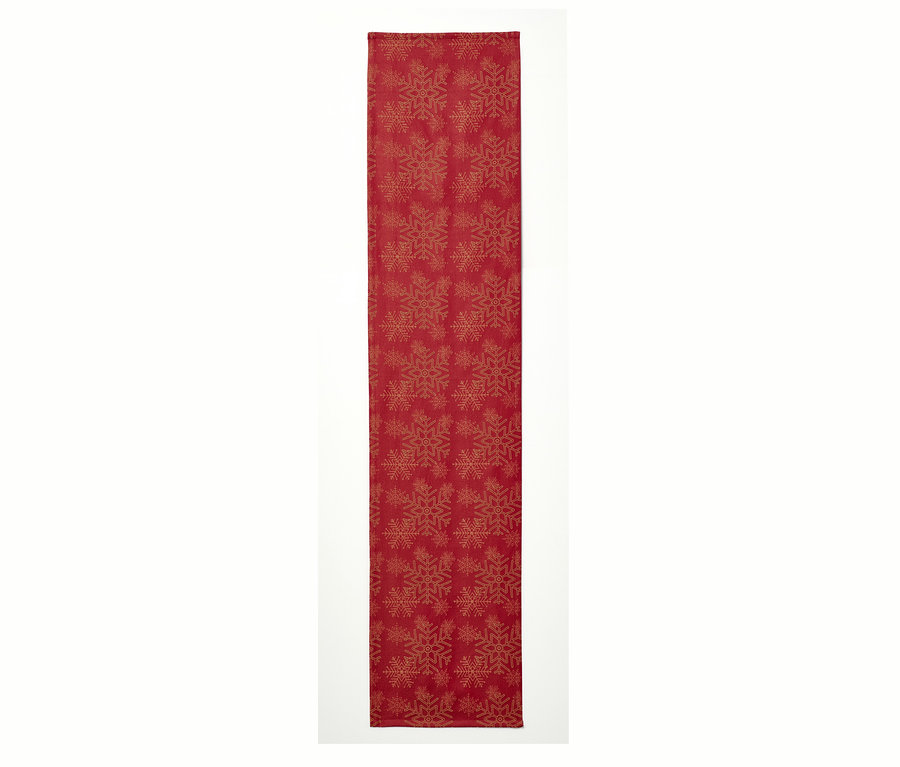 Chemin de table en jacquard rouge avec motif de flocons de neige.