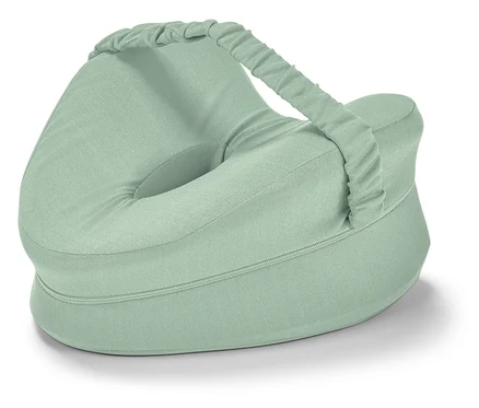 Coussin ergonomique pour genoux pour les personnes dormant sur le côté, vert clair, avec un trou central et une sangle.