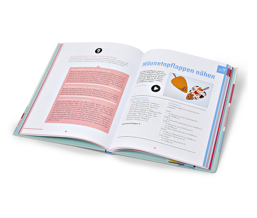 Livre ouvert «	Näh doch einfach	» (Coudre, c'est facile, en allemand) avec des instructions de couture.