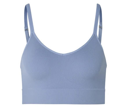 Soutien-gorge de sport bleu clair côtelé avec bretelles réglables sur fond blanc.