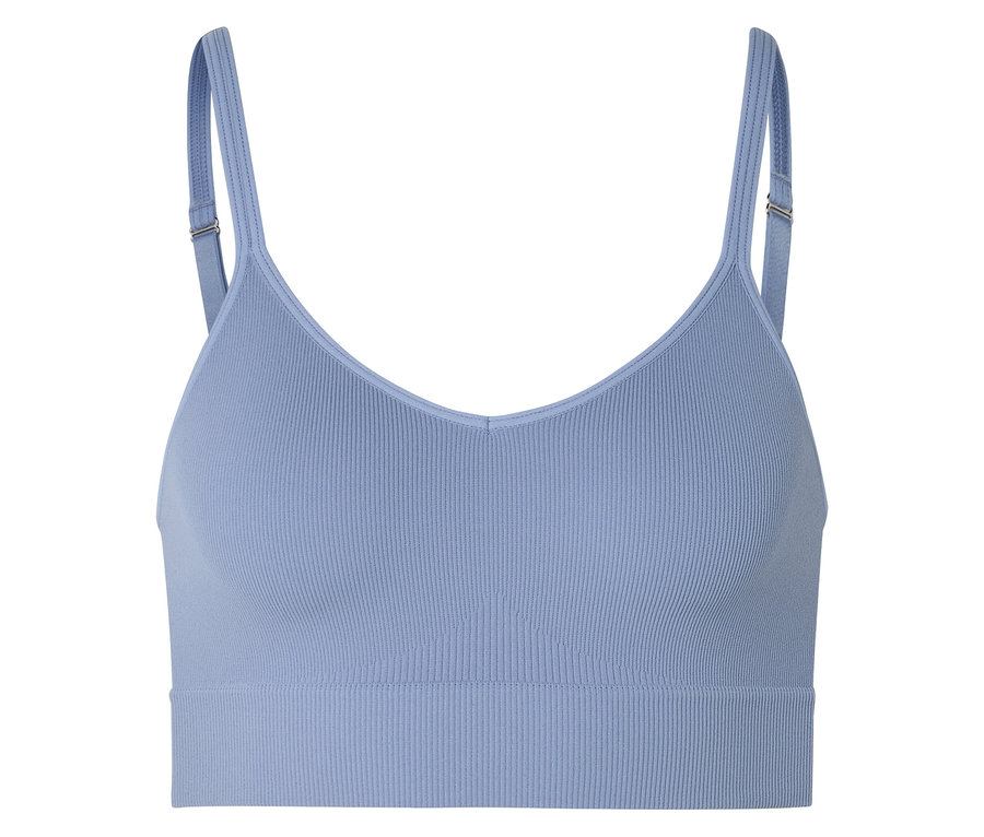 Soutien-gorge de sport bleu clair côtelé avec bretelles réglables sur fond blanc.