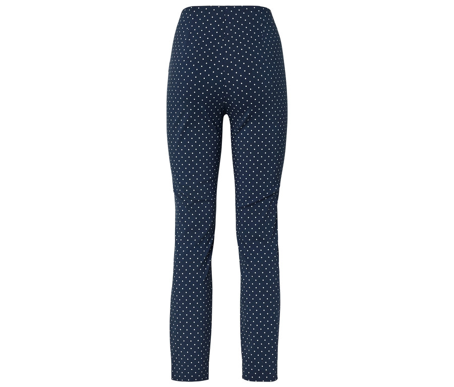 Pantalon bleu marine à pois blancs.