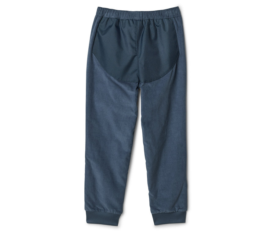 Pantalon de survêtement bleu marine avec taille élastique et chevilles resserrées, photographié de dos.