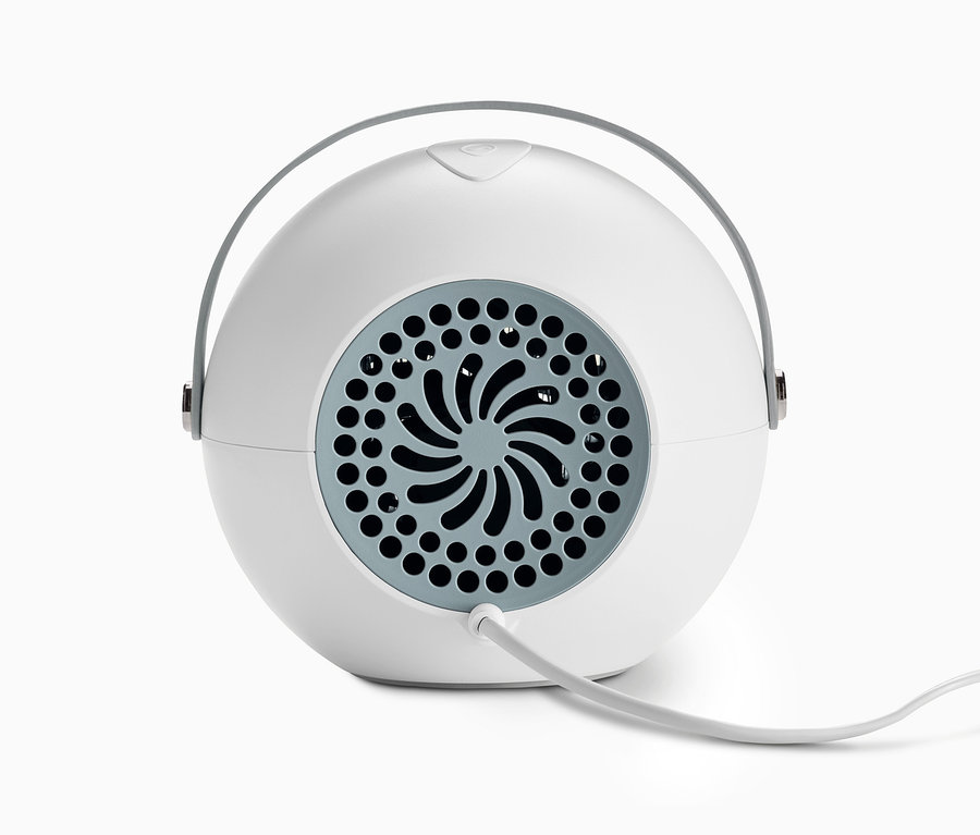 Gros plan d'un radiateur soufflant avec chauffe-mains amovible.