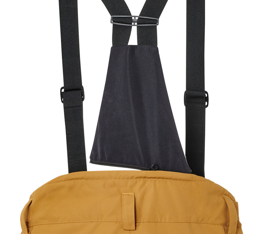 Vue détaillée de l'arrière d'un pantalon de ski camel avec des bretelles élastiques noires.