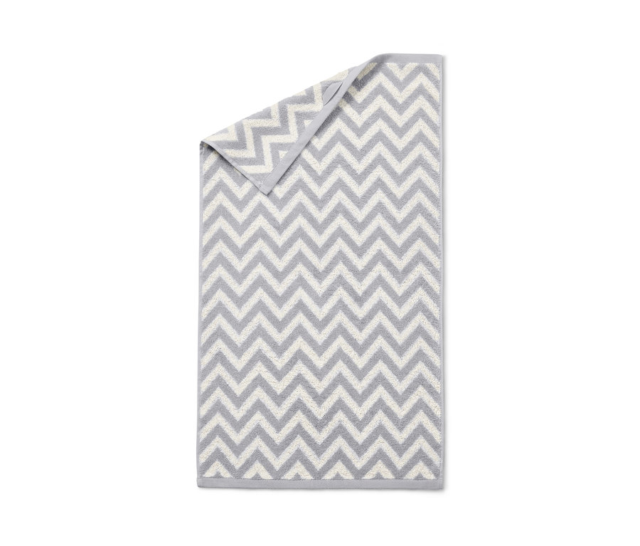 Un torchon jacquard gris à motif à chevrons, 2 pièces.
