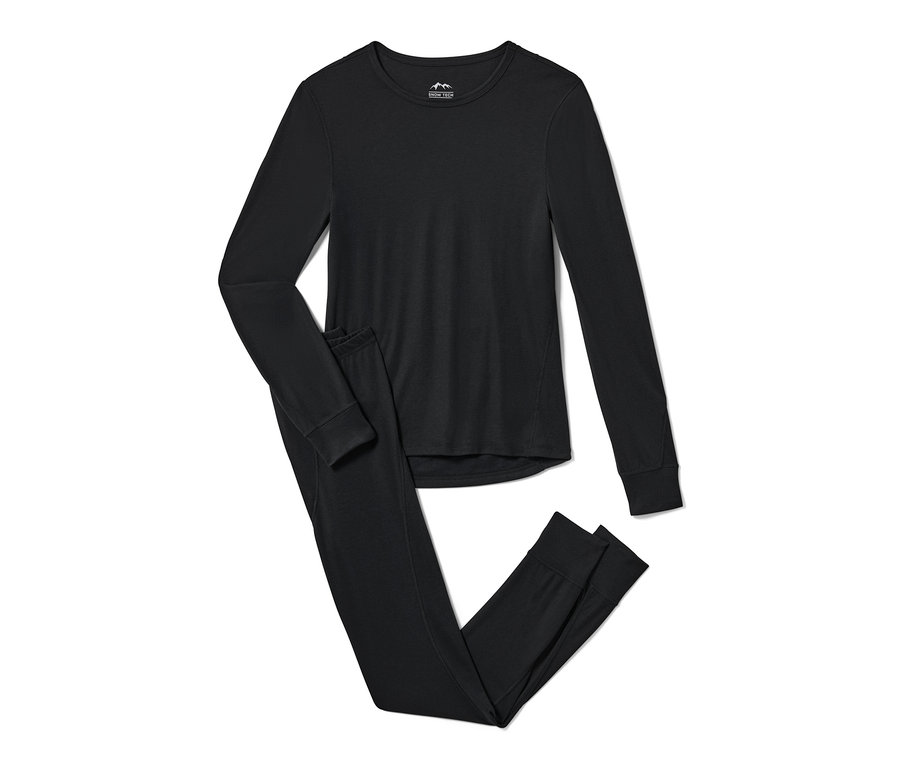 Un ensemble de sous-vêtements fonctionnels thermiques noirs est posé sur un fond blanc.