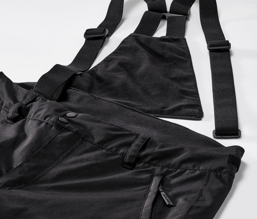 Pantalon de ski noir à bretelles réglables.