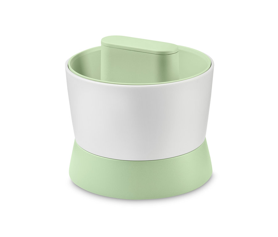 Préparateur pour riz de légumes Veggie Ricer avec base vert clair et centre blanc.