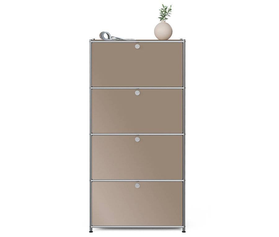 Une armoire à quatre étages avec une fleur et un journal sur le dessus.