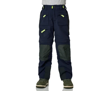 Pantalon zip-off JAKO-O marine avec des accents jaune fluo et des renforts aux genoux, porté avec des baskets vertes.