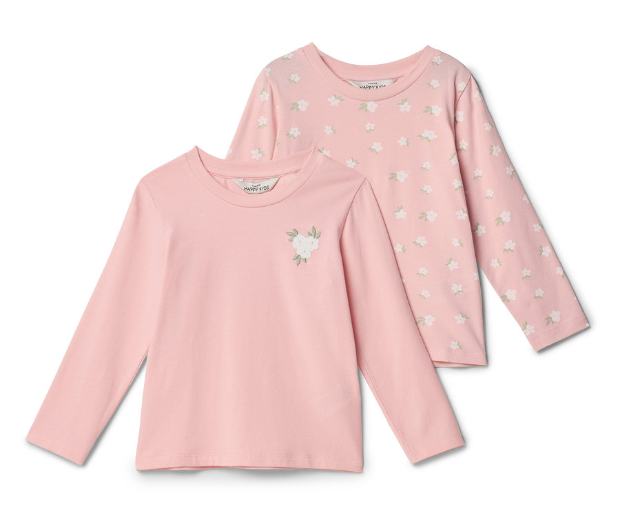 Deux t-shirts roses à manches longues sont superposés. Le t-shirt avant est rose uni avec une application de fleur blanche. Le t-shirt arrière a un motif floral.