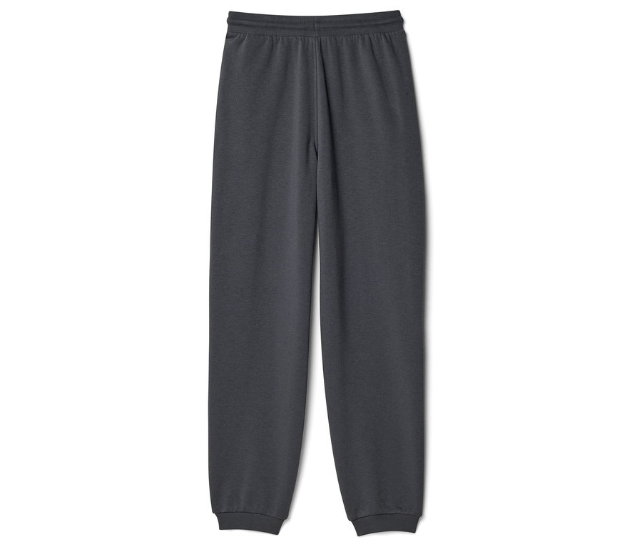 Un pantalon de jogging gris avec une taille et des chevilles élastiquées, posé sur un fond blanc.