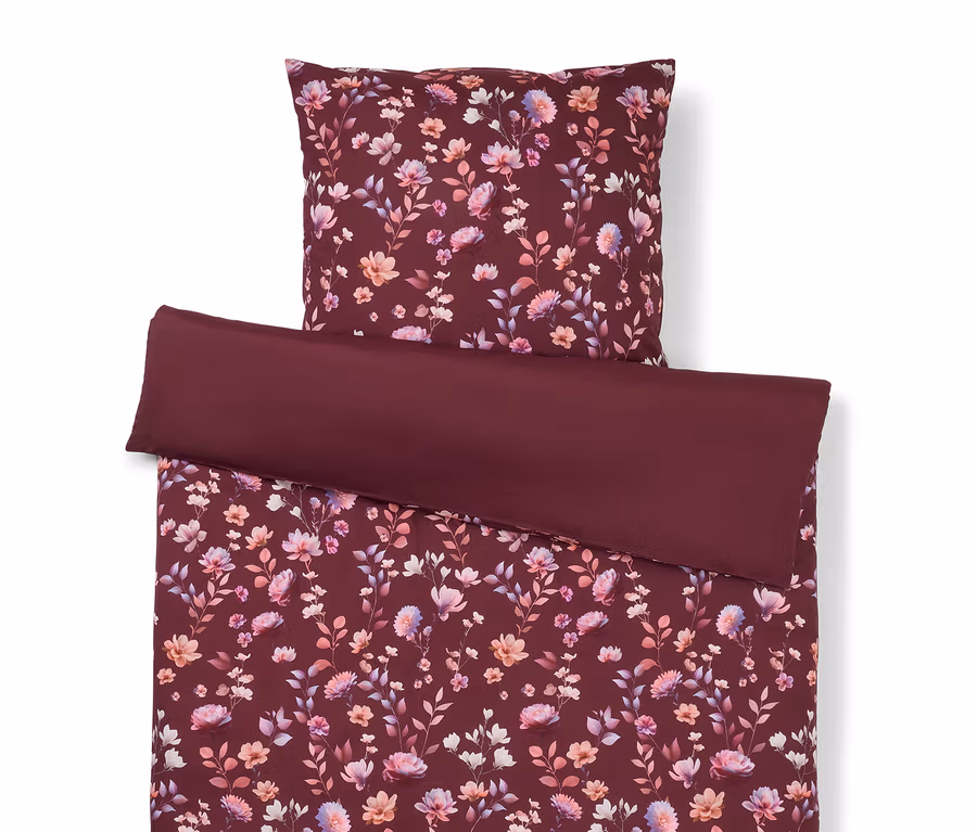 Ensemble de literie à motif floral bordeaux, comprenant une taie d'oreiller et une housse de couette.