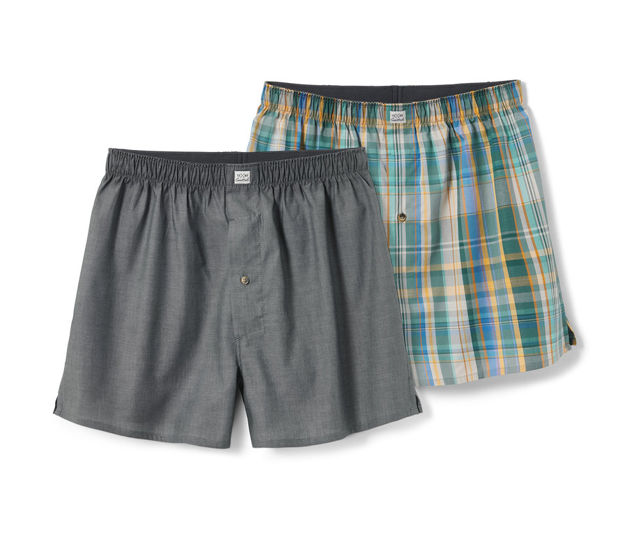 Deux caleçons tissés, un gris et un à carreaux verts, jaunes et bleus.