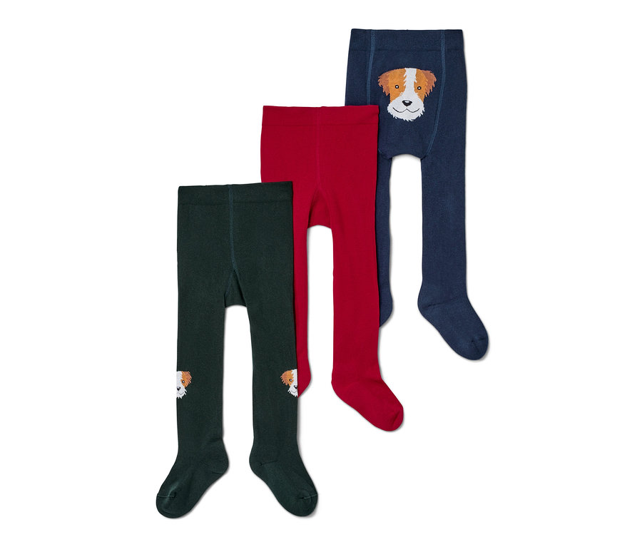 Trois paires de collants pour bébé : vert foncé avec un chien sur le genou, rouge et bleu foncé avec un chien sur le ventre.
