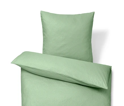 Parure de lit en seersucker verte de taille normale et parure de lit en seersucker de grande taille.