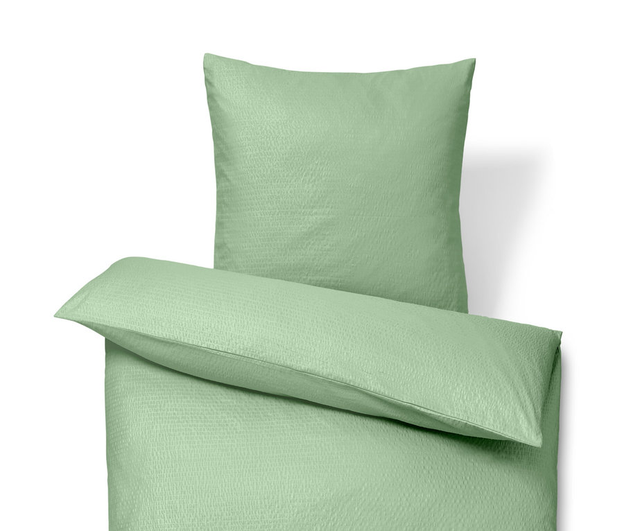 Parure de lit en seersucker verte de taille normale et parure de lit en seersucker de grande taille.