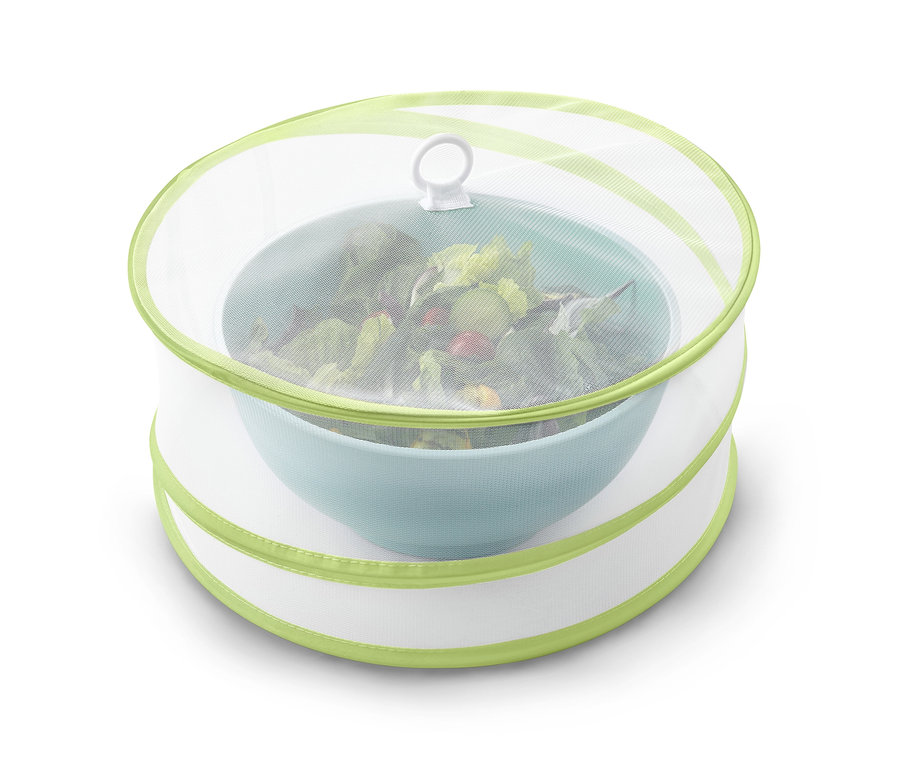 Cloche de protection pliable verte sur un saladier.