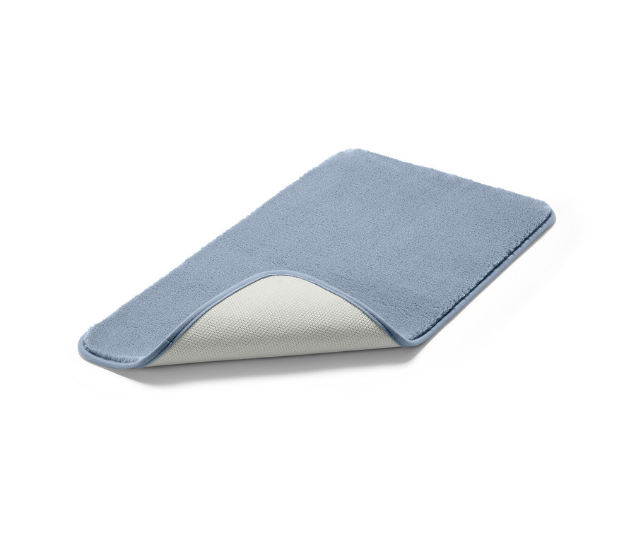 Un tapis de bain bleu, env. 70 x 40 cm.