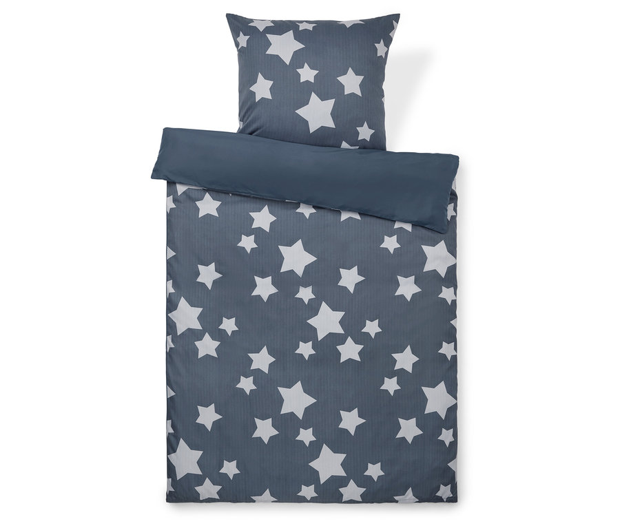 Linge de lit avec motif d'étoiles sur fond gris.
