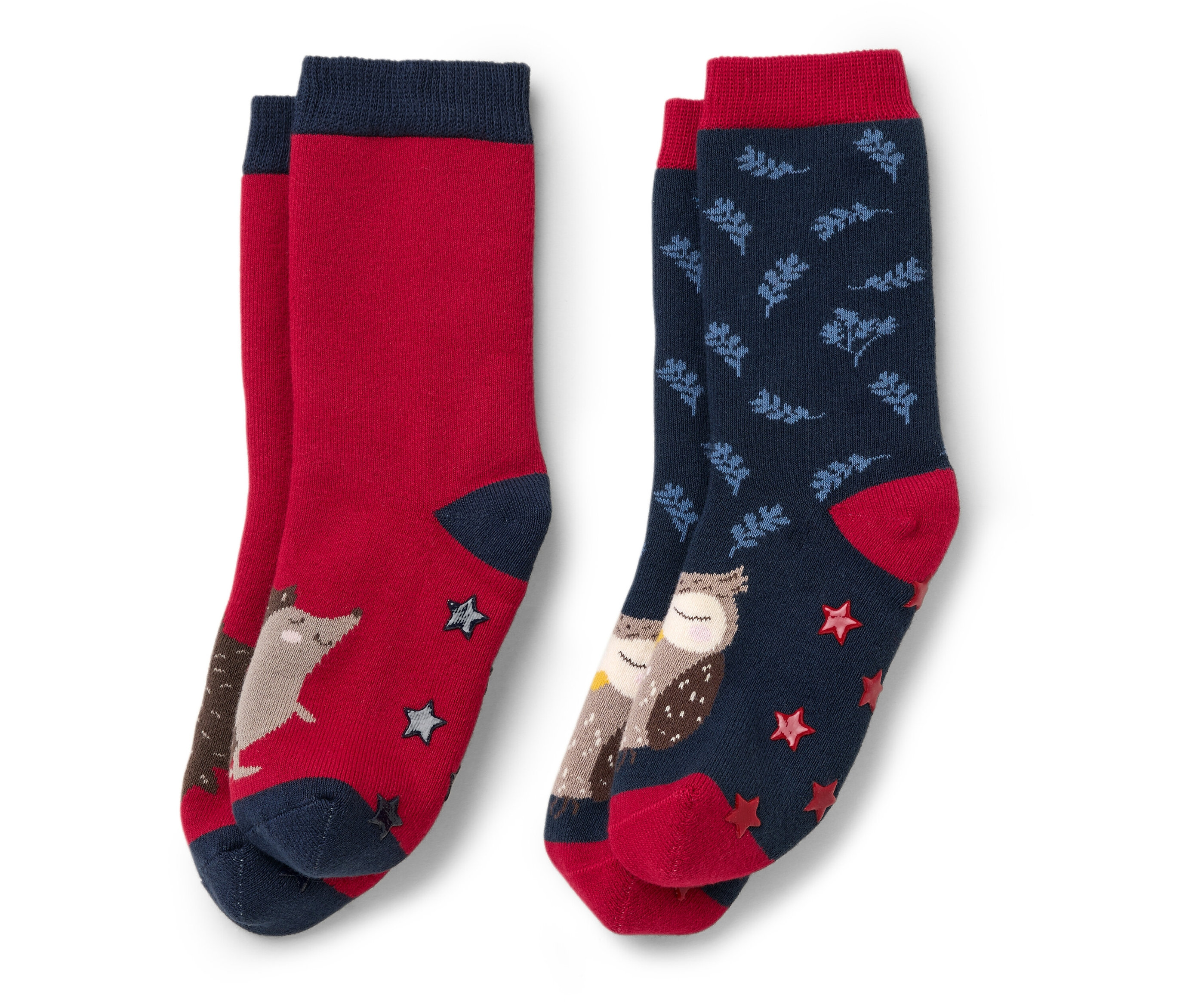 Deux paires de chaussettes antidérapantes pour enfants : une paire rouge avec un renard et des étoiles, une paire bleue avec des hiboux et des feuilles.