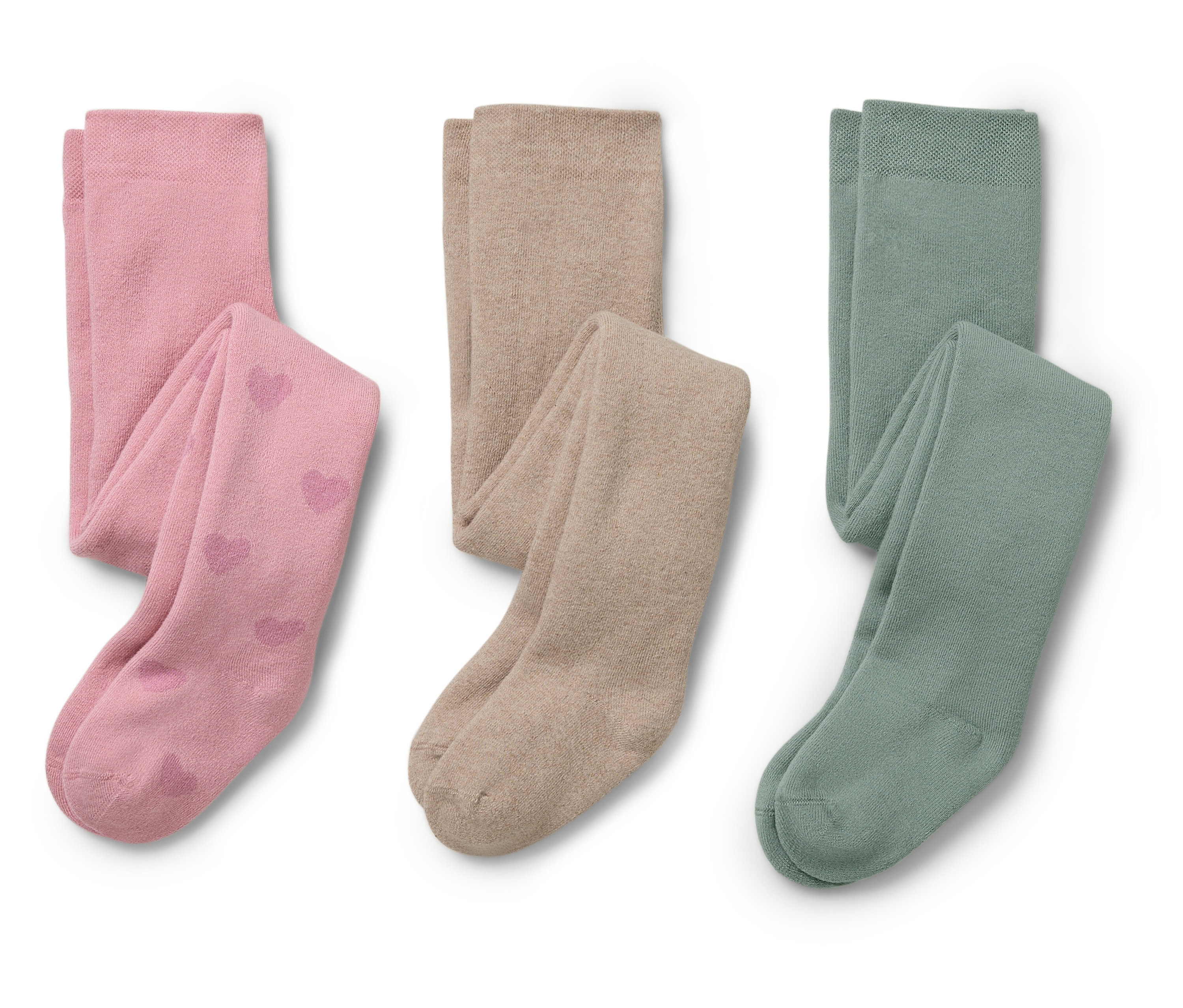Deux paires de collants pour enfants roses avec des motifs de cœurs et deux paires beiges et vertes sont côte à côte.
