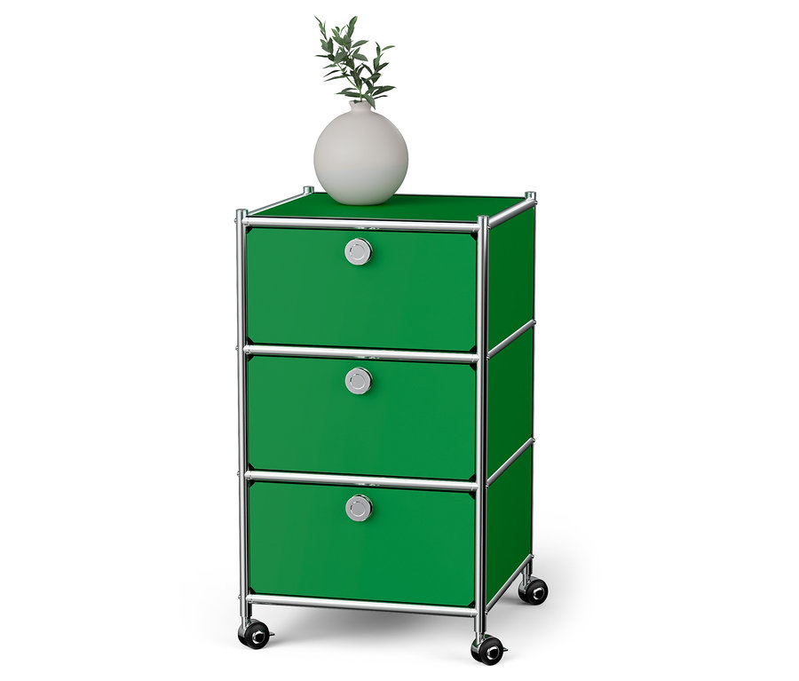 Caisson à roulettes vert « CN3 » avec 3 tiroirs. Un vase blanc est posé dessus.
