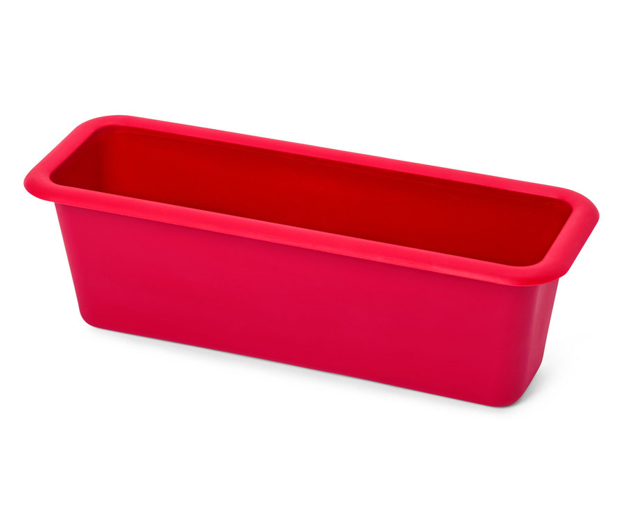 Moule à cake rectangulaire rouge en silicone.