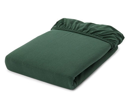 Drap-housse vert foncé, soigneusement plié, avec son bord élastique visible en haut.