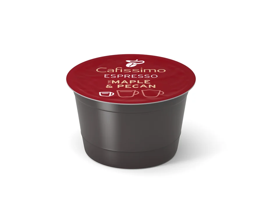 Capsule de café Cafissimo gris foncé avec un couvercle rouge, affichant "Espresso Maple & Pecan" et des icônes de tasses.