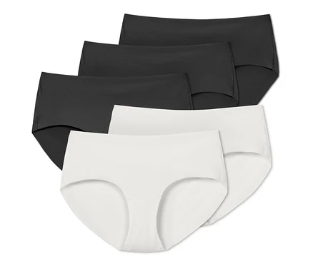 Cinq culottes Magic Cut, noires et blanches, disposées en rangée.
