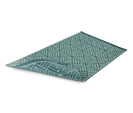 Un tapis d'extérieur vert avec un motif géométrique.
