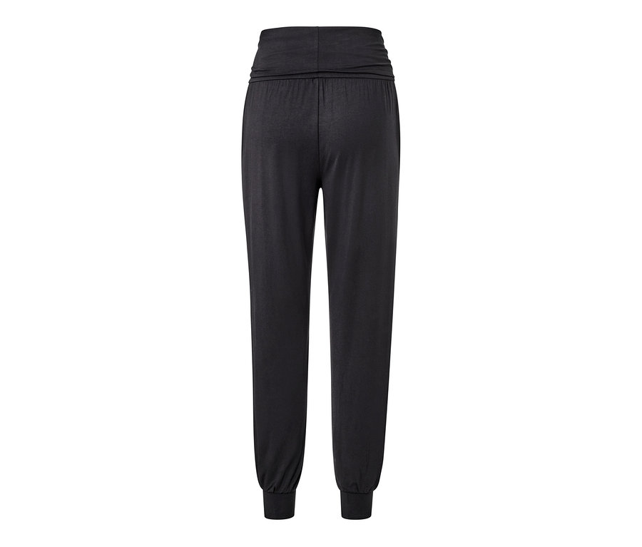 Pantalon de yoga noir avec taille élastique et poignets.