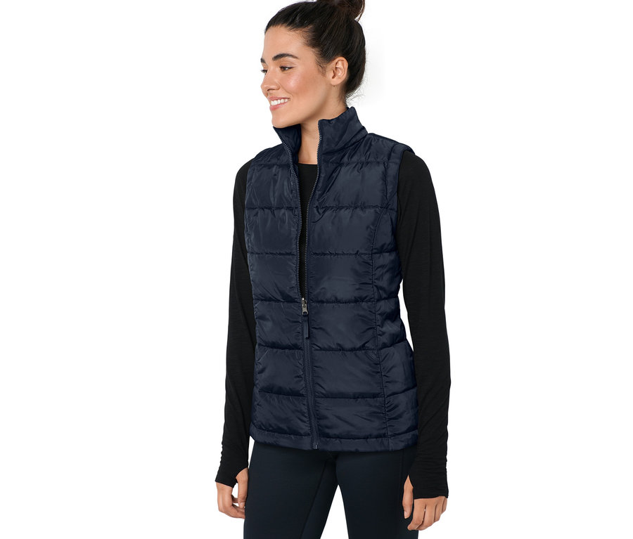 Femme portant un gilet pétrole du manteau d’extérieur 3 en 1.