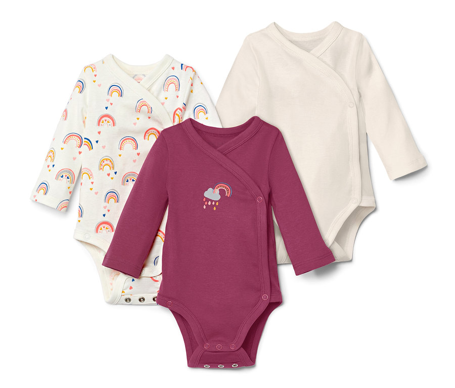 Trois bodys à manches longues avec motifs arc-en-ciel.