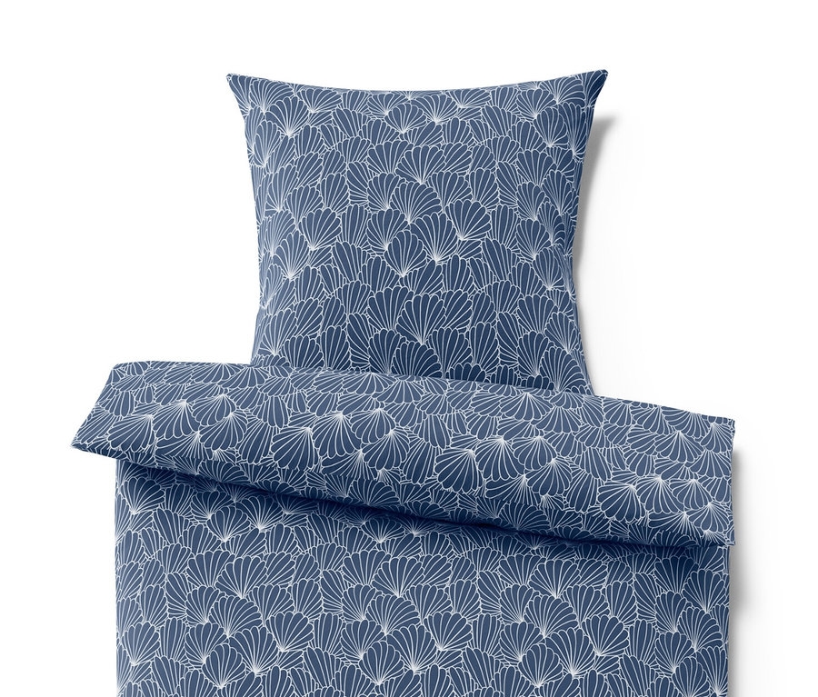 Parure de lit bleu en microfibre avec motif coquillage.