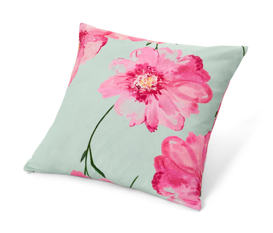 Housse de coussin décorative avec motif floral.
