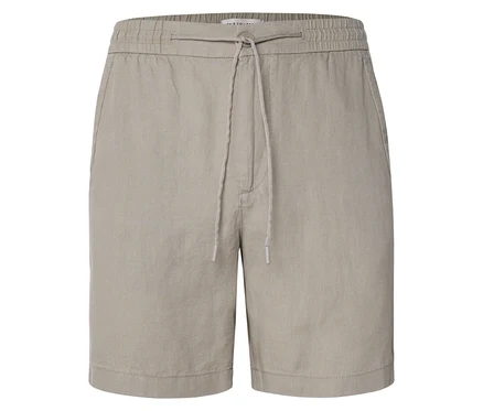 Gros plan sur un short beige avec cordon de serrage.
