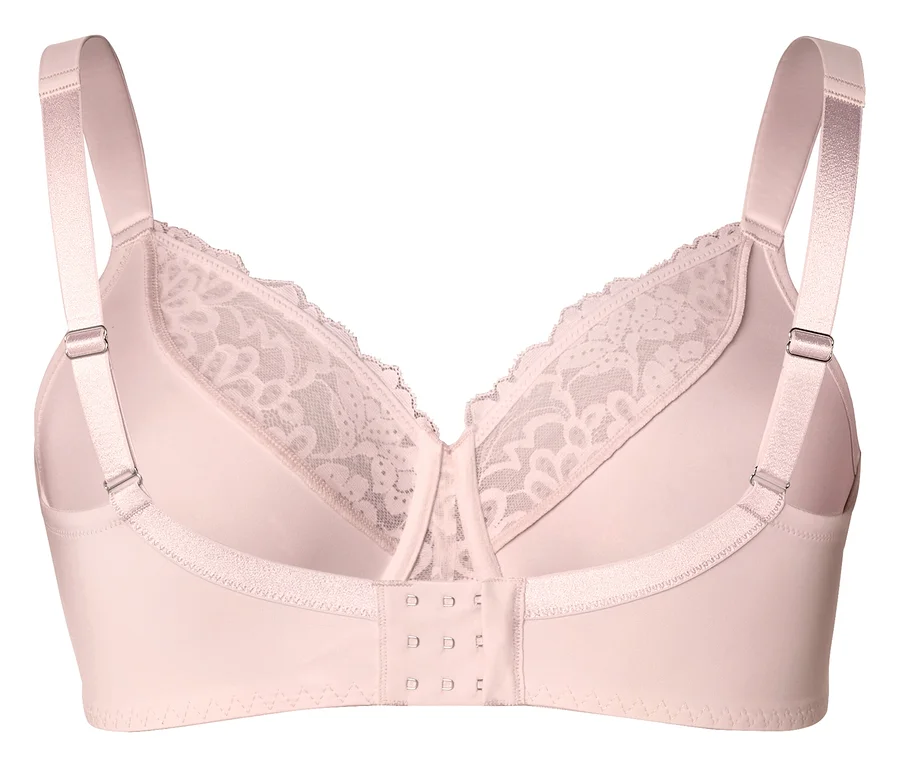 Gros plan d'un soutien-gorge rose clair avec bretelles réglables et dentelle florale.