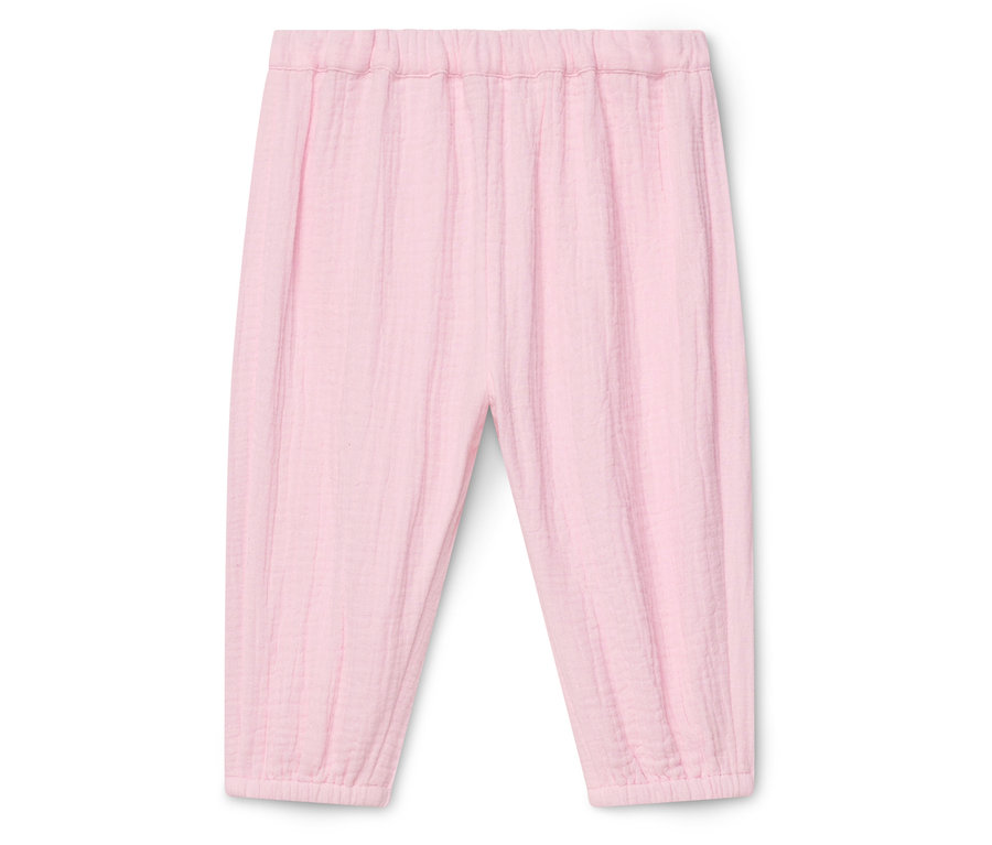 Pantalon rose ample avec taille élastique et chevilles élastiquées.