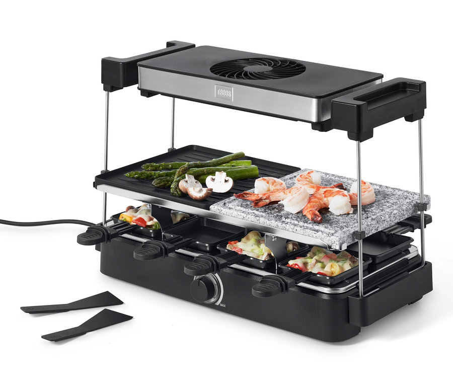 Four à raclette Trebs avec hotte aspirante et plaque de pierre avec crevettes, asperges et champignons.