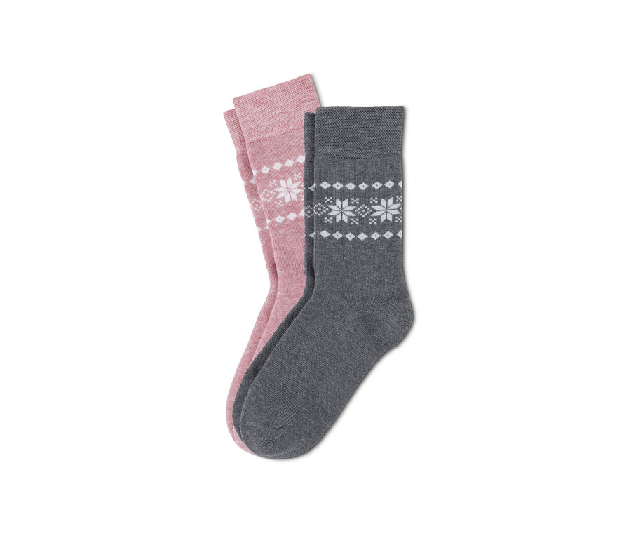 Deux paires de chaussettes thermiques : une paire rose et une paire grise, les deux avec un motif de flocons de neige.