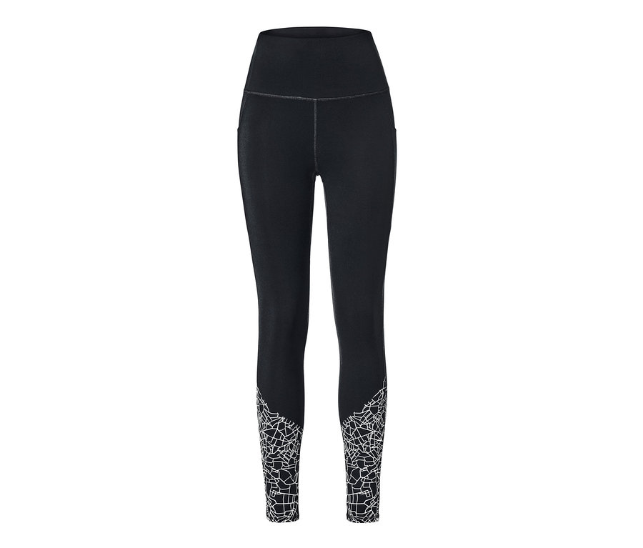 Legging de sport noir avec un motif géométrique blanc en bas des jambes.