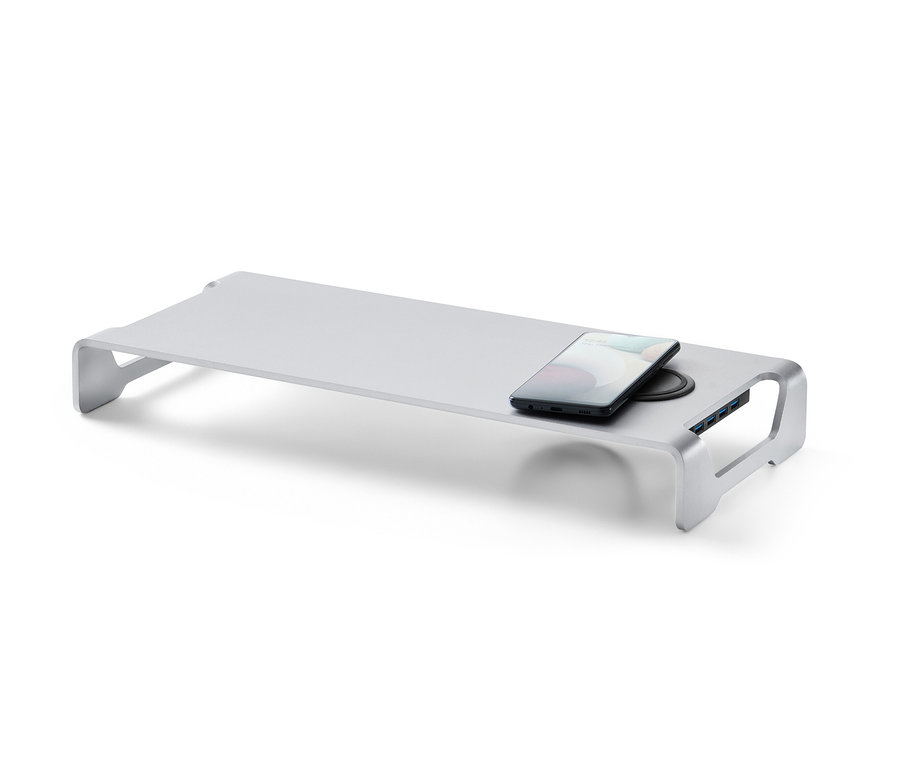 Support à écran argenté avec station de charge sans fil et hub USB. Un téléphone portable est posé sur la station de charge.