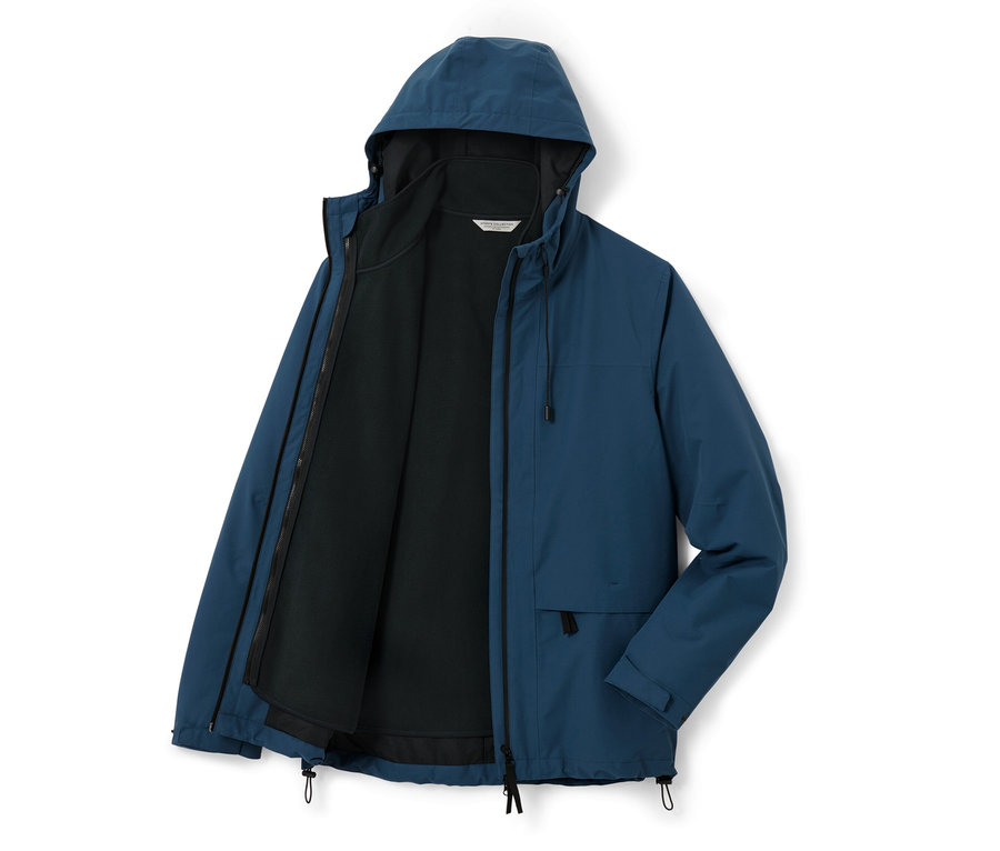 Veste d’extérieur bleue avec gilet sans manches, la veste est ouverte.