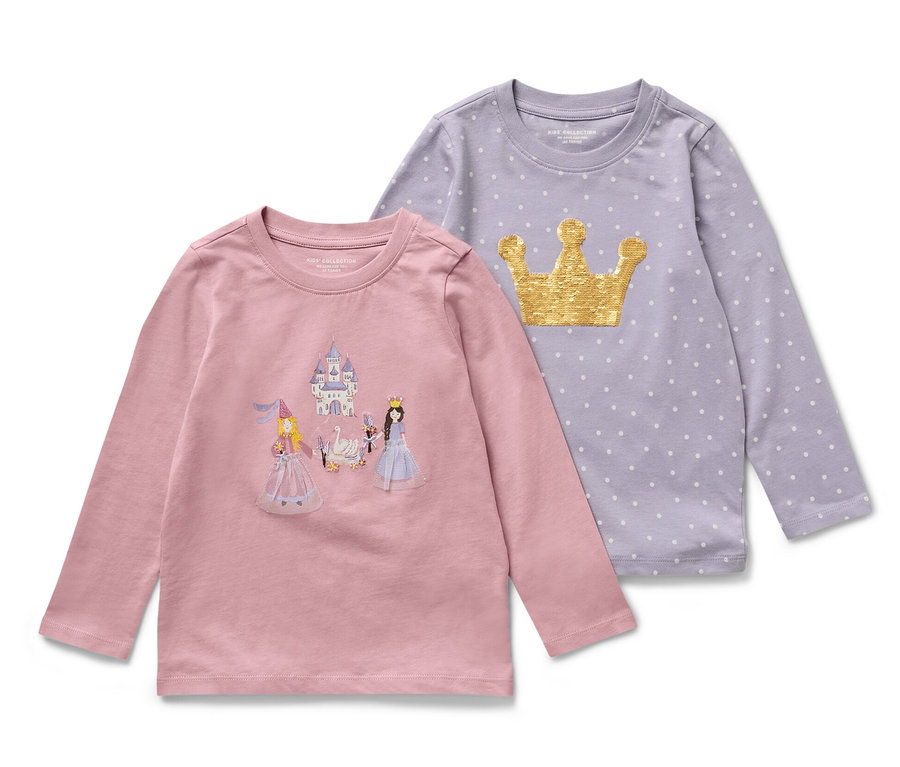 Deux t-shirts à manches longues pour enfants sur le thème des princesses. Un t-shirt rose avec un château et des princesses, et un t-shirt violet avec une couronne dorée et des pois.
