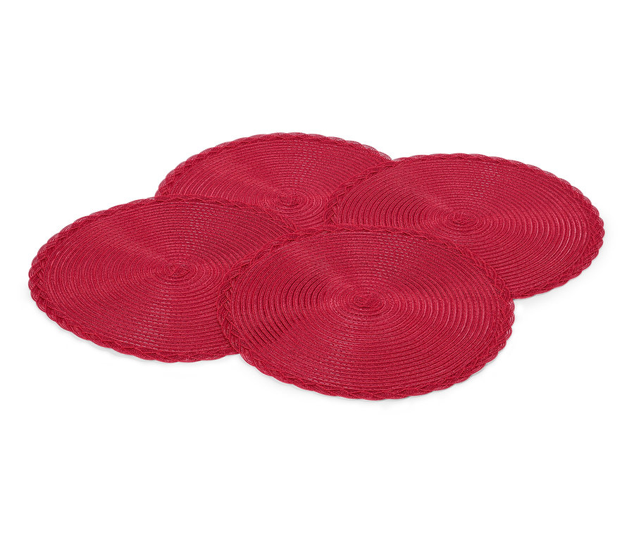 Quatre sets de table ronds rouges sur fond blanc.