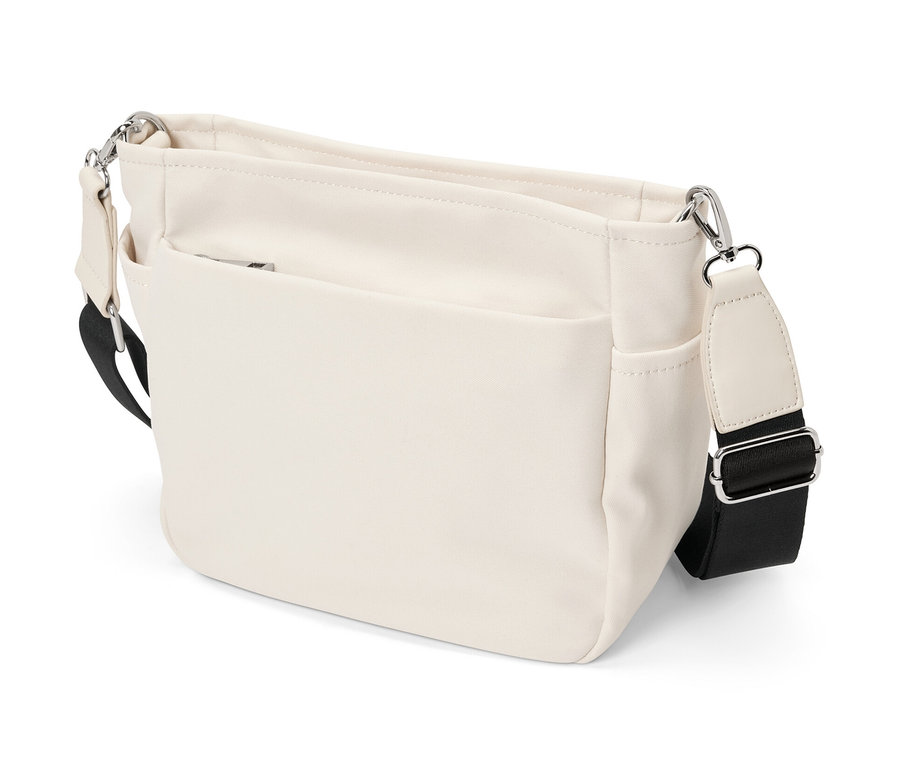 Un banane en toile couleur crème avec une bandoulière noire.